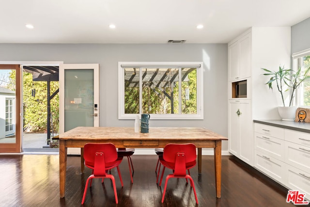 dining area with dark wood-type flooring