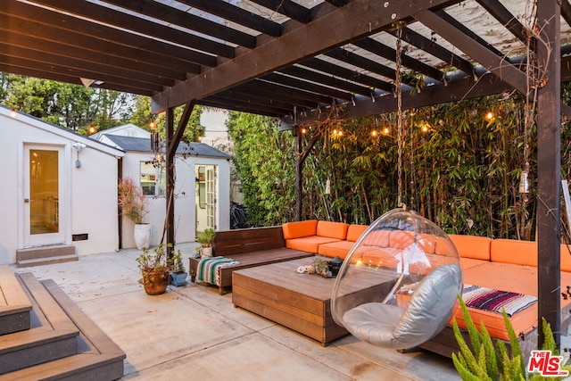 view of patio / terrace featuring a pergola, an outdoor structure, and an outdoor living space