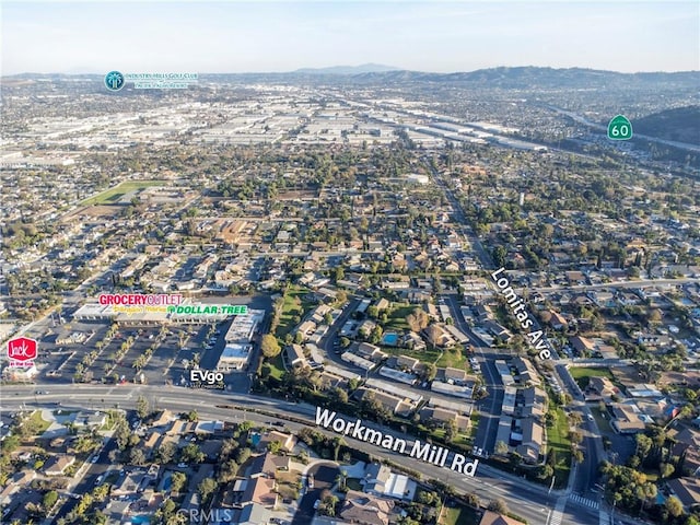 birds eye view of property with a mountain view