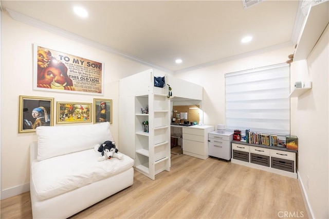 sitting room featuring light hardwood / wood-style flooring and ornamental molding