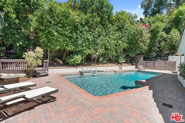 view of swimming pool featuring a patio