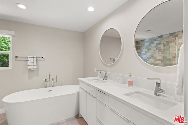 bathroom with separate shower and tub and vanity