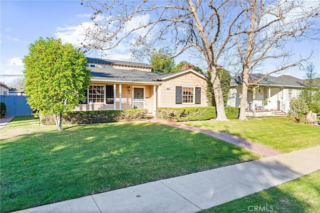 single story home with a front lawn and a porch