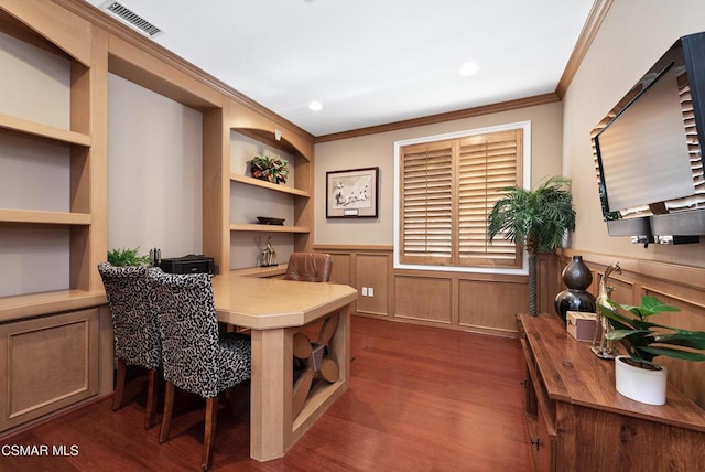 home office featuring dark wood-type flooring, built in features, and crown molding