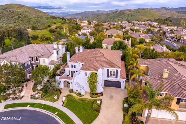 birds eye view of property featuring a mountain view