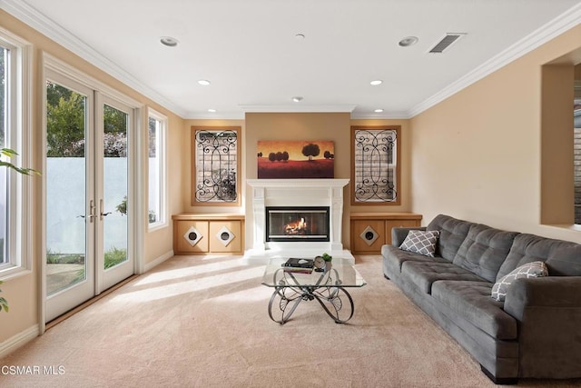 carpeted living room featuring ornamental molding