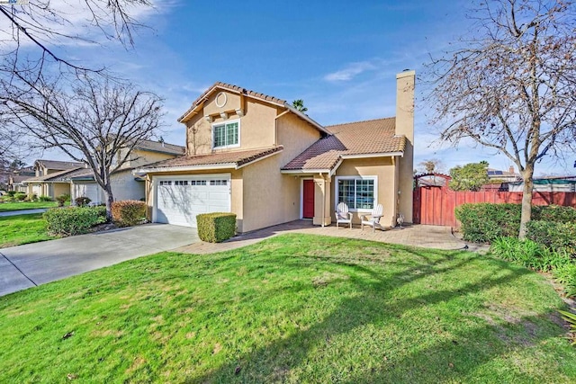 view of front of home with a front yard and a garage