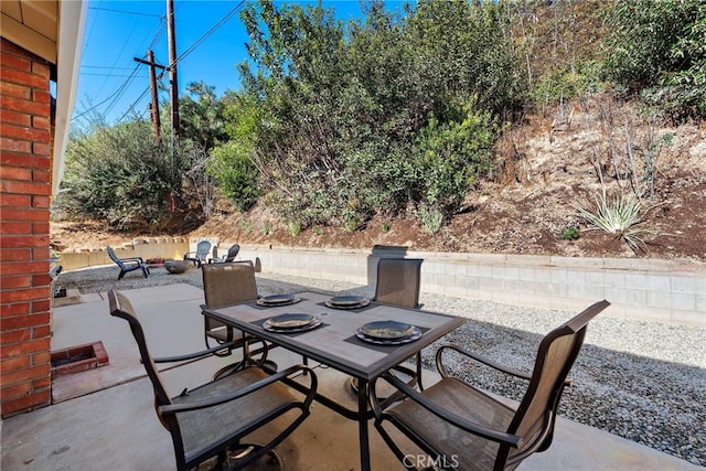 view of patio featuring outdoor dining area
