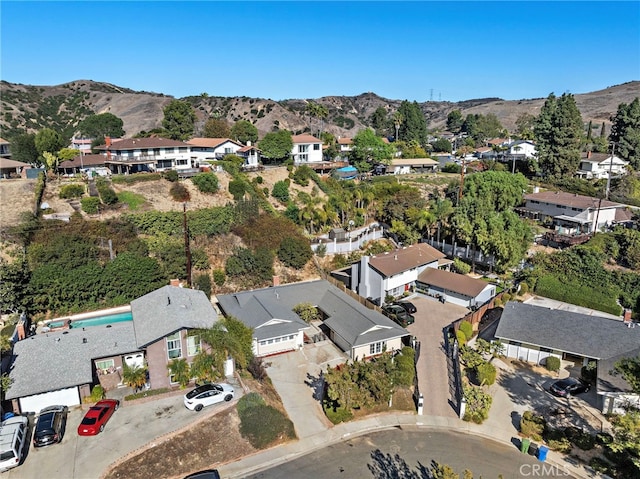 birds eye view of property with a residential view and a mountain view
