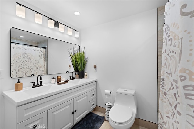 full bathroom featuring toilet, vanity, and recessed lighting