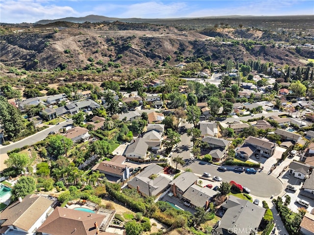 birds eye view of property featuring a mountain view and a residential view