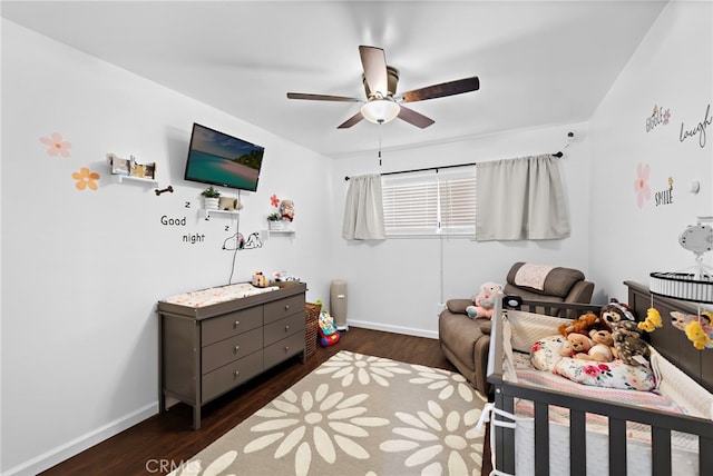bedroom with baseboards, a ceiling fan, and wood finished floors