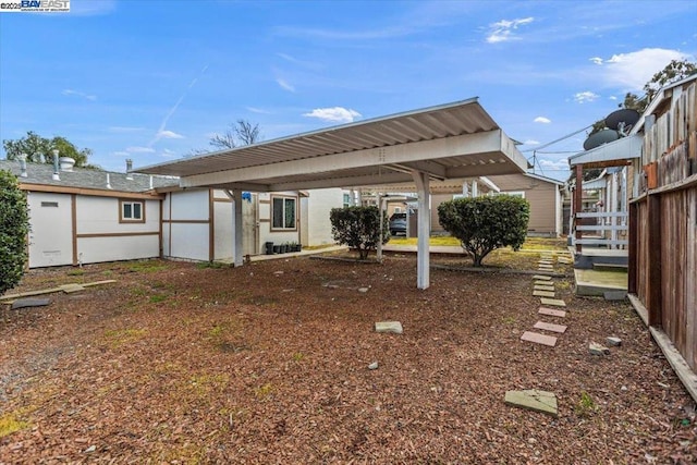 view of yard with a carport