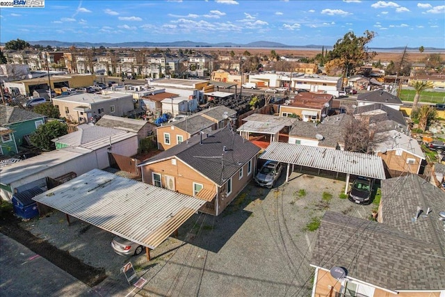 birds eye view of property with a mountain view