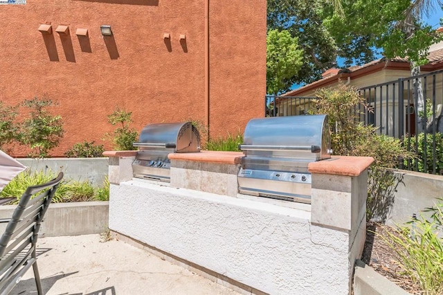 view of patio / terrace featuring exterior kitchen and area for grilling