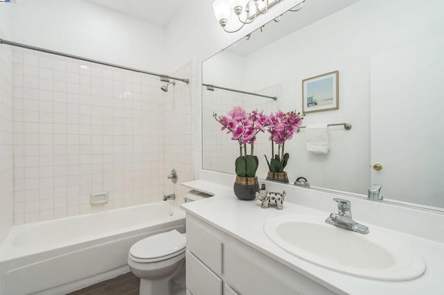 full bathroom with toilet, bathtub / shower combination, vanity, and hardwood / wood-style flooring