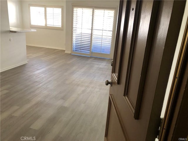 empty room with hardwood / wood-style floors