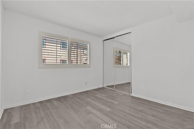 empty room featuring wood-type flooring