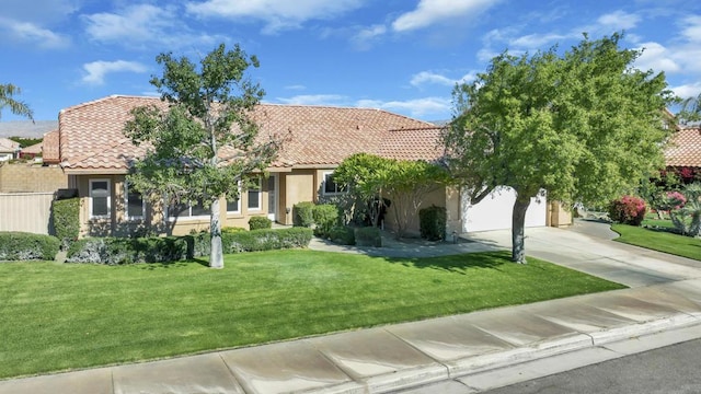 view of front of property with a front lawn and a garage