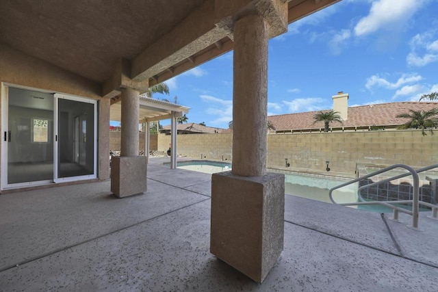 view of patio featuring a fenced in pool