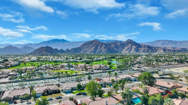 birds eye view of property featuring a mountain view