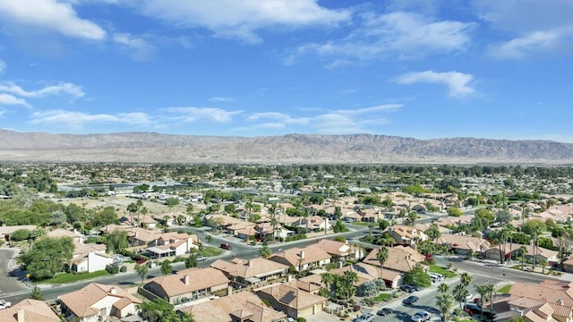 birds eye view of property featuring a mountain view