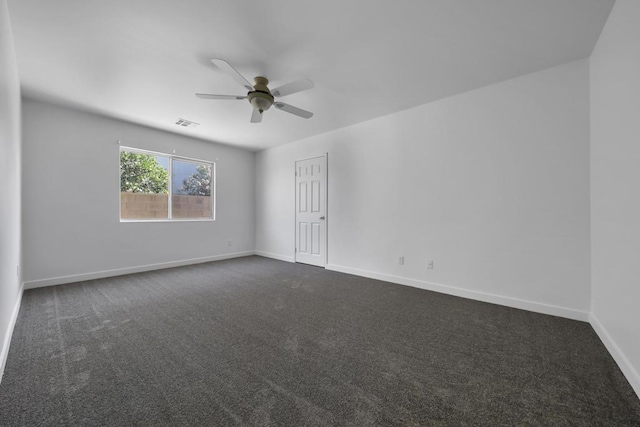 carpeted empty room featuring ceiling fan