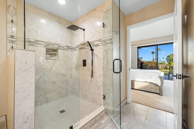 bathroom featuring a shower with door