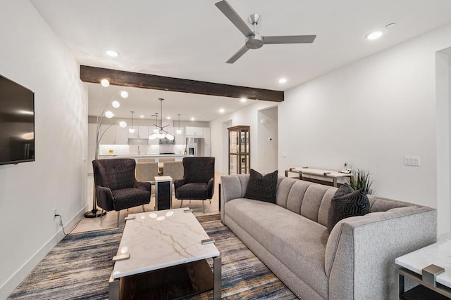 living room featuring ceiling fan and beam ceiling