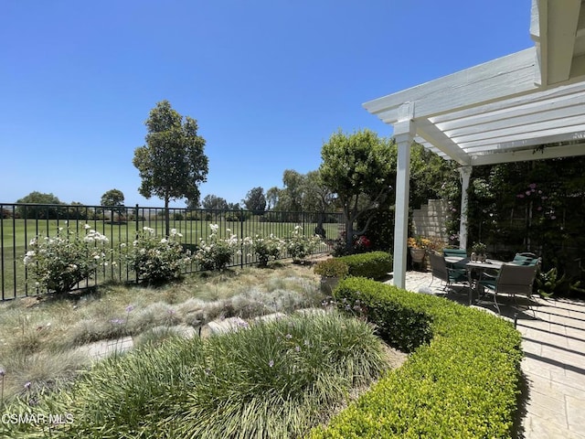 view of yard with a patio and a pergola