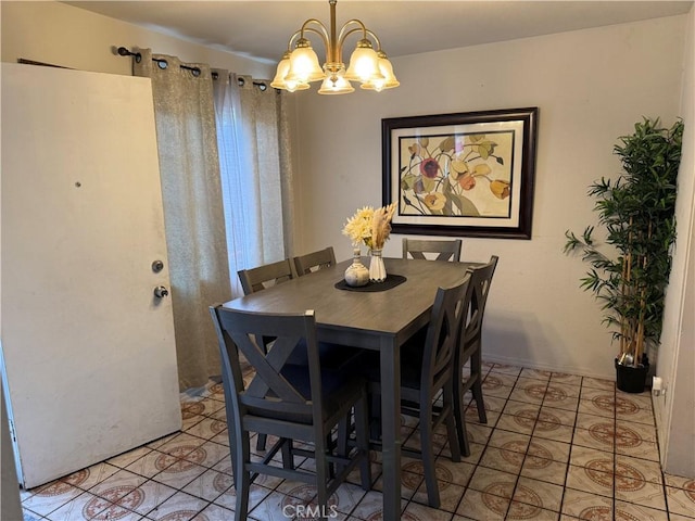 dining area featuring light tile patterned floors and an inviting chandelier