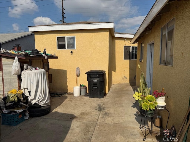 view of side of property featuring a patio area