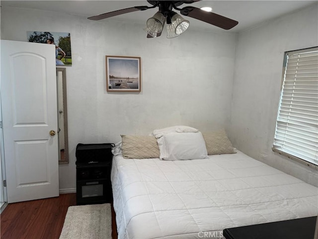 bedroom featuring ceiling fan and wood-type flooring