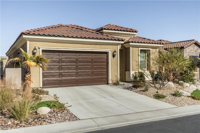 mediterranean / spanish-style house featuring a garage