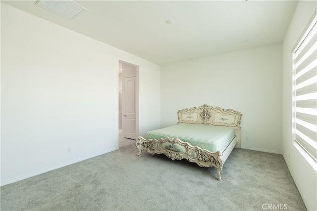 bedroom featuring light colored carpet