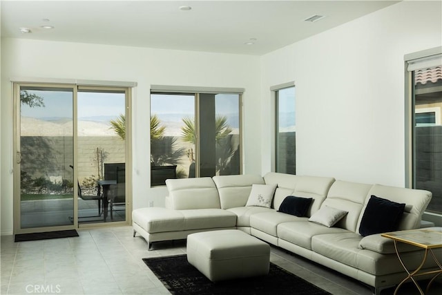 living room with light tile patterned floors