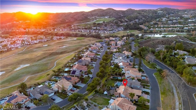 aerial view at dusk with a water and mountain view