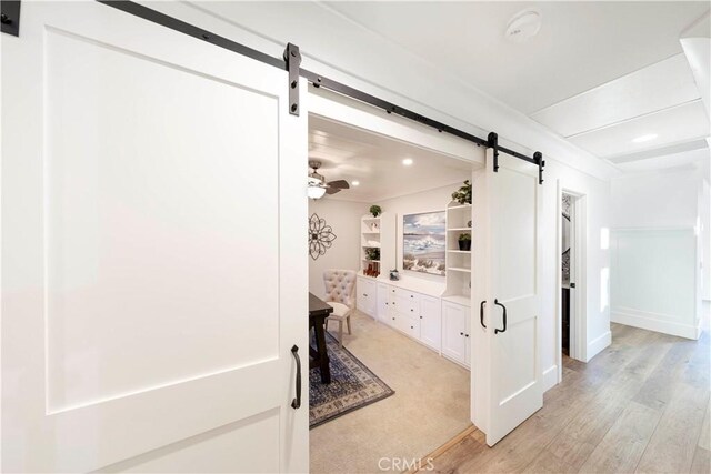 bathroom with hardwood / wood-style flooring and ceiling fan