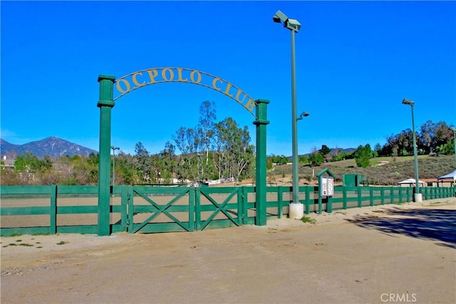 view of gate featuring a mountain view