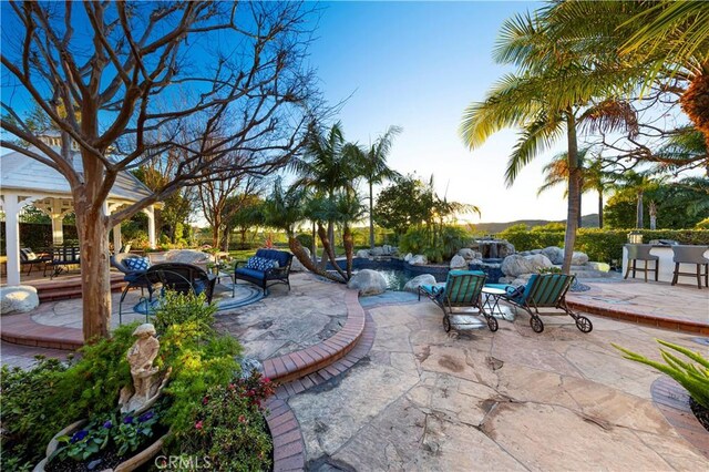 view of patio terrace at dusk