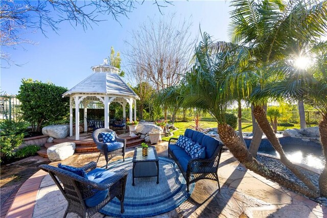 view of patio / terrace featuring an outdoor living space and a gazebo