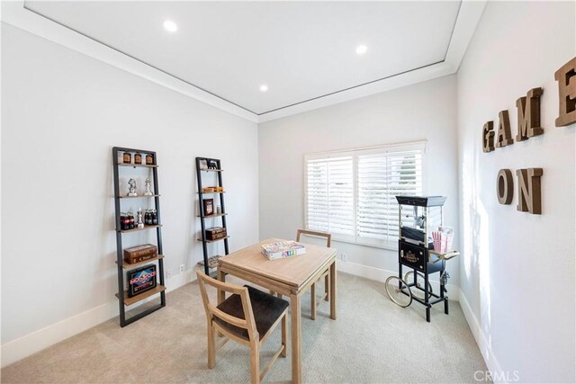 carpeted home office with ornamental molding