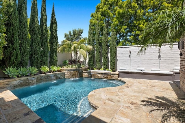 view of swimming pool featuring a patio and pool water feature