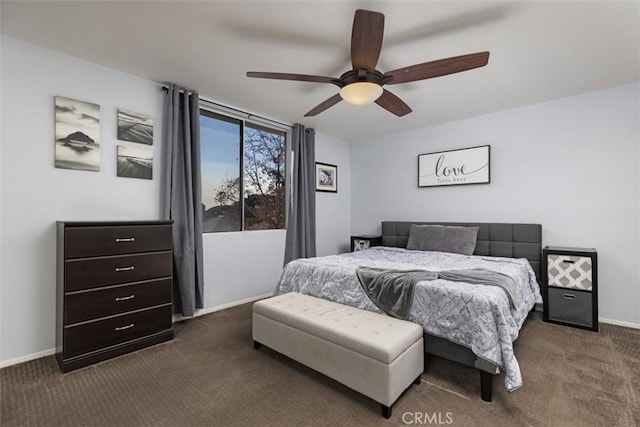 bedroom with dark colored carpet and ceiling fan