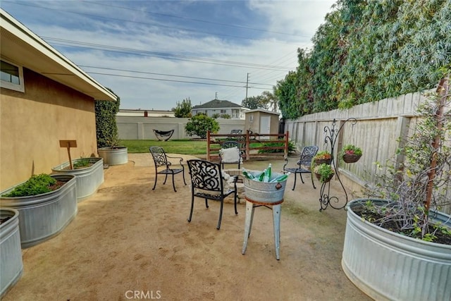 view of patio / terrace with a storage shed