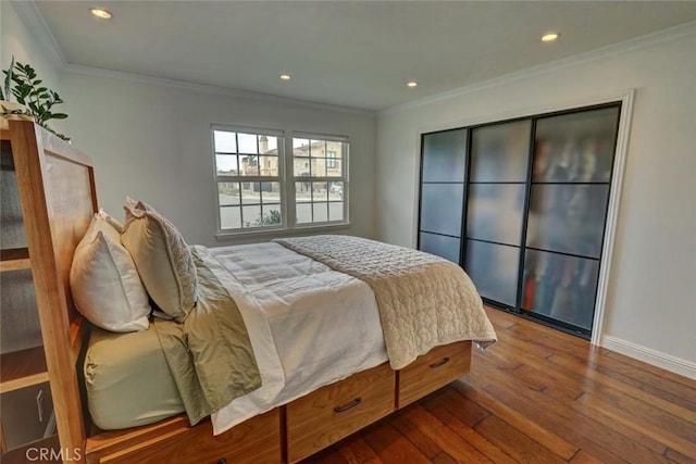 bedroom featuring hardwood / wood-style flooring and crown molding