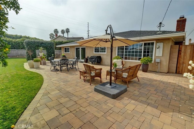 rear view of property with a patio, an outdoor hangout area, and a yard