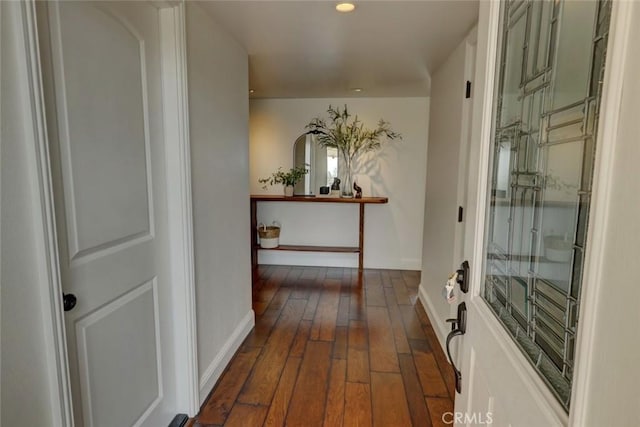 hall with dark wood-type flooring