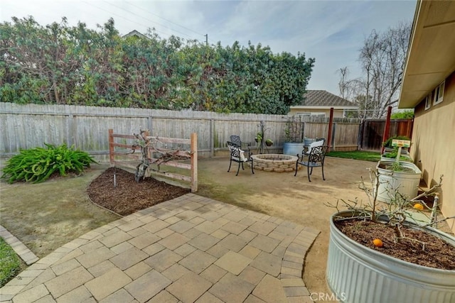 view of patio with an outdoor fire pit