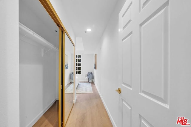 hallway with light wood-type flooring